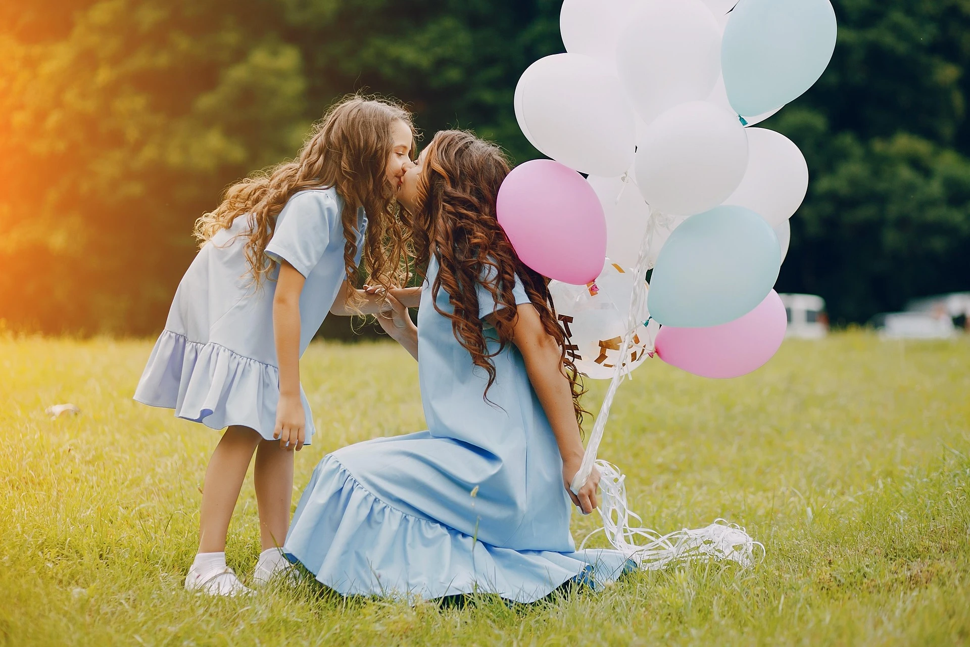 Mother Daughter Balloon Kiss